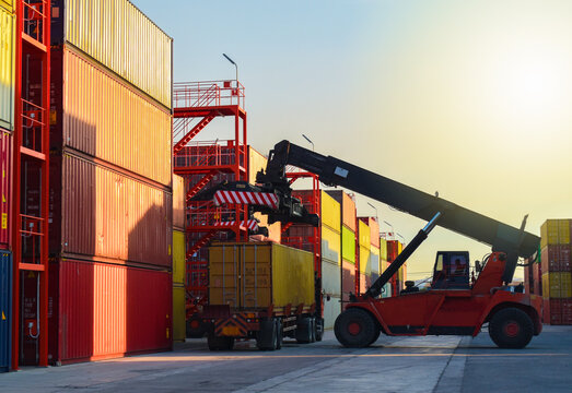 Reach Stacker Loading Shipping Container onto Semi Truck Trailer