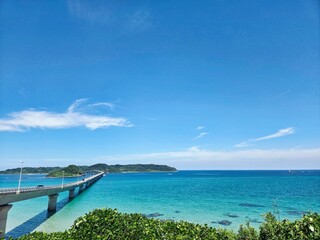 Fototapeta premium a blue sea and a long bridge