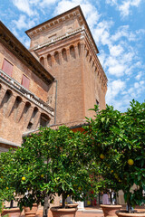 Obraz premium Estense Castle (Castello Estense di Ferrara, castello di San Michele, St. Michael's castle) in Ferrara old city center - Garden of the oranges