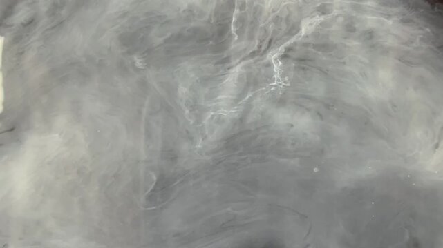 Abstract latte spill forming smoky fluid patterns. Elegant background for coffee branding, luxury visuals, and cinematic overlays.