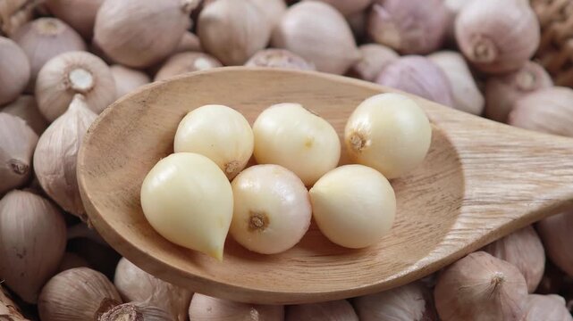 Video of Fresh garlic in wood spoon