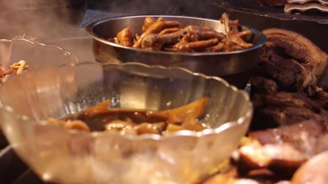 Braised pig organ on a Kueh Chap stall. Kueh Chap is a noodle soup dish featuring flat, broad rice sheets with dark soy-based broth