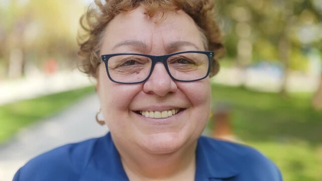 Overweight Senior Woman with eyeglasses Smiling Confidently at the Camera