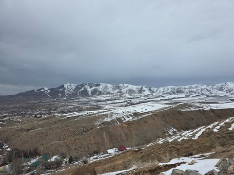 Mountain Range covered in Snow in Kumushkon, Uzbekistan