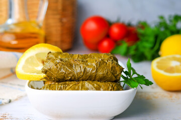 Delicious yaprak dolma (sarma) stuffed grape leaves rice. Lebanese dolma sarma on plate 