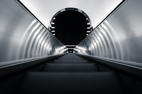 Upward escalator in modern subway station
