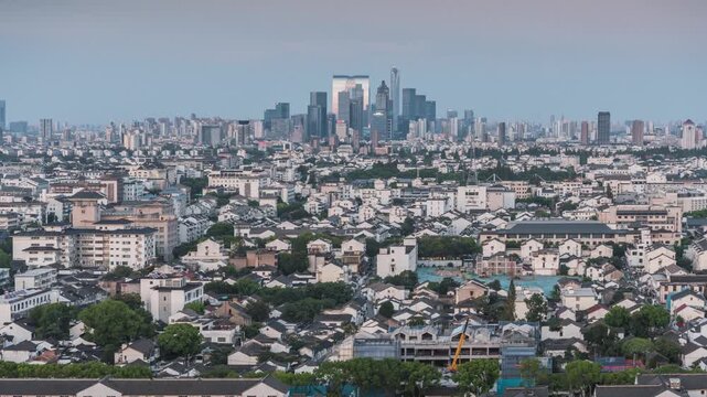 Time-lapse of Gate of the Orient at Suzhou Huxi CBD, stunning sunset to night urban skyline and traffic light trails, Jiangsu, China