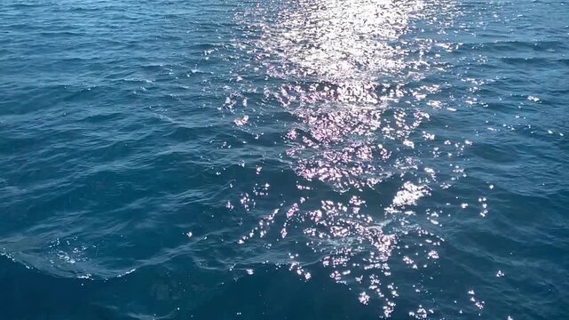 Deep blue ocean water surface with gentle waves