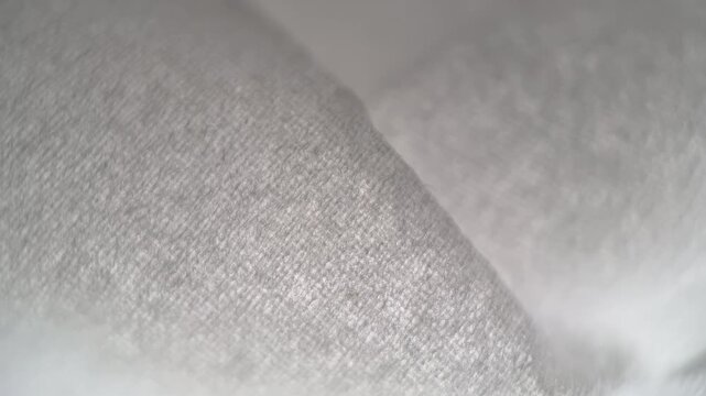 Soft white tissue paper macro with subtle motion. Clean, minimal background ideal for skincare, hygiene, and modern branding.