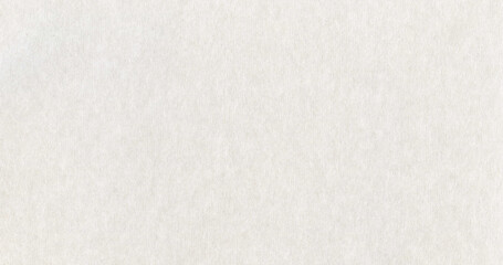 Fototapeta premium Surface of grey paper or cardboard, background, texture. Backdrop of smooth gray paper surface with elements of aging. Flat and a little bit fibrous paper. Fragment of thick, grayish paper surface