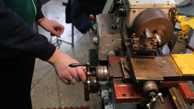 A person operating a metalworking machine