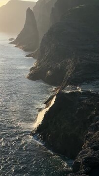 Bosdalafossur waterfall flowing from Sorvagsvatn lake into the Atlantic Ocean, Vagar Island, Faroe Islands