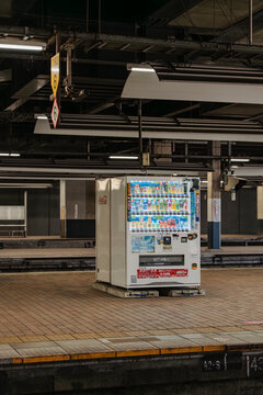 May 26, 2024, Kitakyushu, Japan - A Coca-Cola vending machine on an empty train station platform