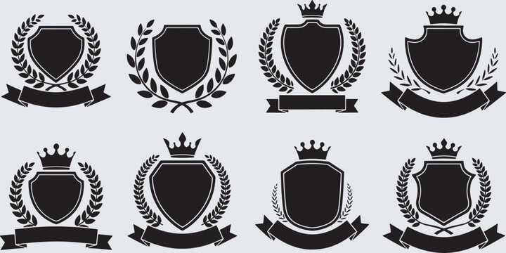 Collection of blank black shields with crowns, laurel wreaths, and banners, ideal for heraldry and emblems.