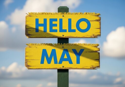 A yellow signpost with hello may written on it in blue letters under a cloudy sky