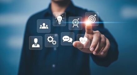 Fototapeta premium Businessman's finger interacts with digital interface showing icons representing core business elements like teamwork ideas targets processes communication and employee well-being