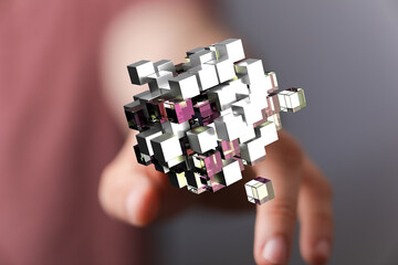 Abstract design of a hand touching a 3D cube structure, symbolizing technology, innovation, and...