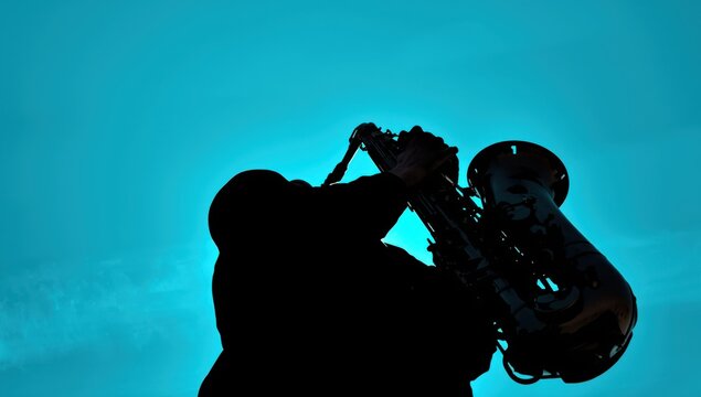 underside perspective of a musician with a baritone saxophone set against a turquoise sky