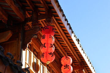 Ancient chinese eaves with ornate decoration and hanging with lanterns at Songzhou Ancient City in Songpan County, Sichuan Province of China © Crystaltmc