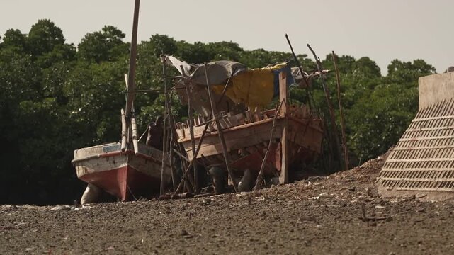 Old dhow boat hull on beach or shore coastal Kenya East Africa travel heritage shot