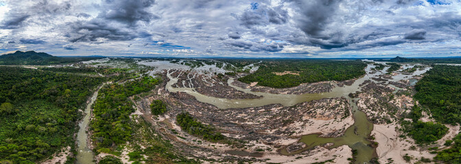 Khone Phapheng Waterfall, the largest waterfall on the Mekong River, features powerful multi-tiered cascades rushing over massive rock formations, creating one of the most dramatic natural © Narong Niemhom