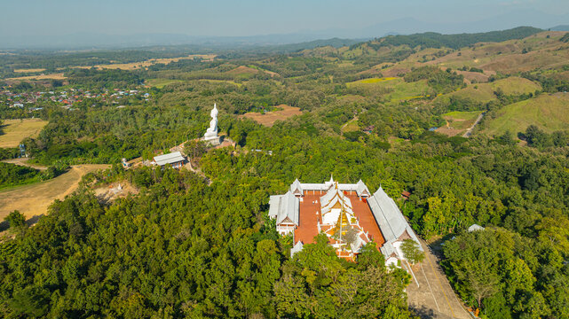 Wat Phra That Pu Jae is a historic mountain temple in Rong Kwang District, Phrae, recognized as a national archaeological site. The ancient square pagoda enshrines a sacred Buddhist relic 