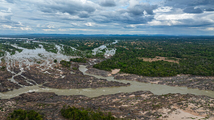 Khone Phapheng Waterfall, the largest waterfall on the Mekong River, features powerful multi-tiered cascades rushing over massive rock formations, creating one of the most dramatic natural © Narong Niemhom