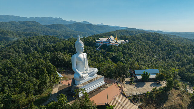 Located in the mountains of Phrae Province, Wat Phra That Pu Jae is an ancient Buddhist temple known for its square stupa containing a sacred relic of the Buddha. This peaceful heritage site reflects 