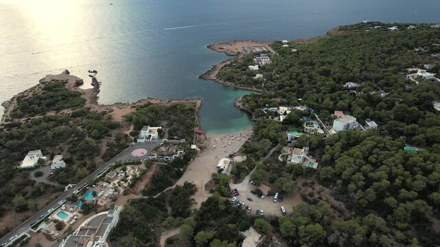Aerial images of the city of cala Graci&oacute;, on the island of Ibiza during a sunny summer day, Balearic Islands, cala salada, 4k 30fps