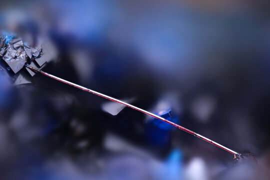 red cuprite var. chalcotrichite on blue Azurite. Specimen from. Micro photography extreme close-up. microscope mineral crystal photography for Scientific use