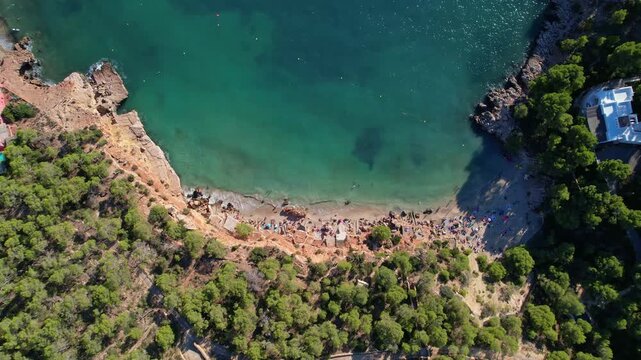 Aerial images of cala Saladeta, on the island of Ibiza during a sunny summer day, Balearic Islands, cala salada, 4k 30fps