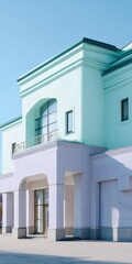 Naklejka premium Mint and pale pink neoclassical building with arched openings balcony and columned portico under clear blue sky exterior urban architecture