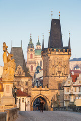 Fototapeta premium charles Bridge in Prague Czech Republic at sunrise with historic statues