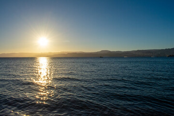 Obraz premium Beautiful Sunset over Red Sea in Aqaba, Jordan. Gulf of Aqaba and view over Israeli City Eilat.