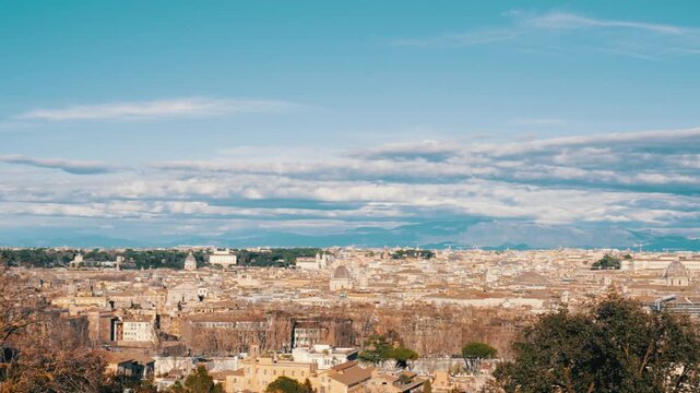 Beautiful panoramic cityscape of Rome, the eternal city, viewed from the Janiculum hill, a famous viewpoint in Italy. The ancient historical buildings and domes are visible on a sunny day