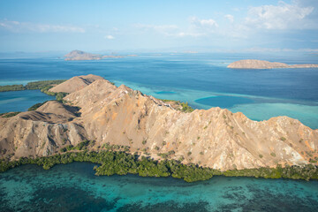 Aerial view of Pulau Siaba Besar island on a sunny tropical day © Hector