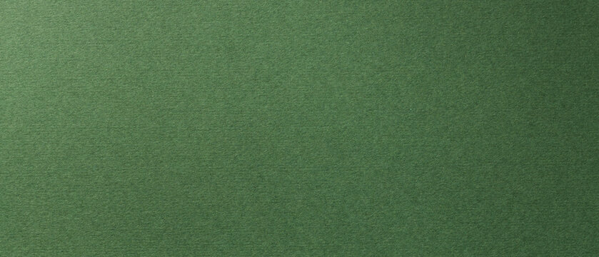 Dark green textured paper background with visible fiber pattern for design projects