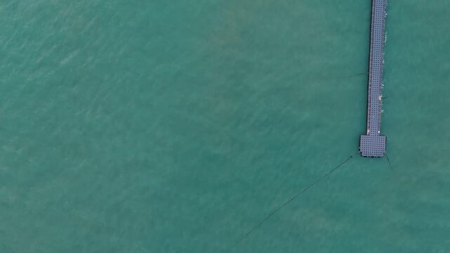 Overhead drone geometric dock pattern by the sea Thailand