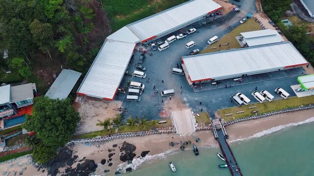 Tour bus parking lot near Siray Bay Phuket drone view Thailand