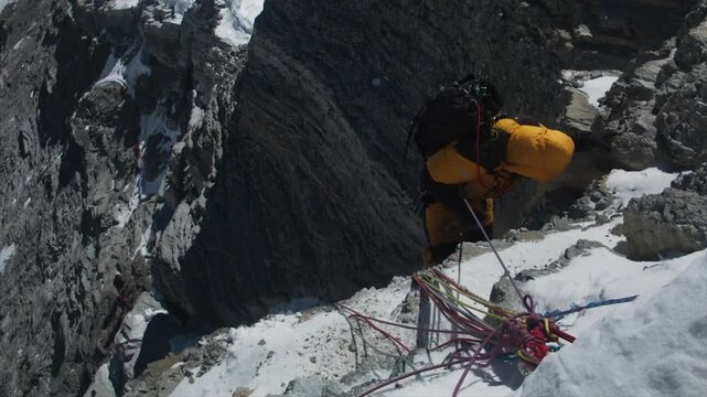 Extreme climber traversing a perilous and exposed snowy ridge during a Mount Everest expedition