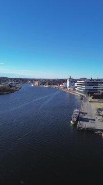 StreetDome and the marina with a clear view of Haderslev city. The footage highlights modern architecture, waterfront activity and the scenic blend of urban life and natural surroundings