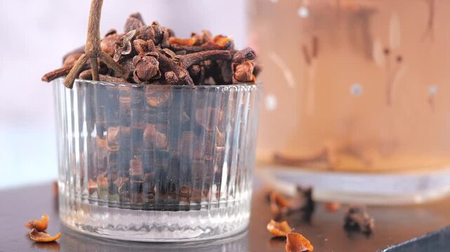 Making clove tea in a simple kitchen setup