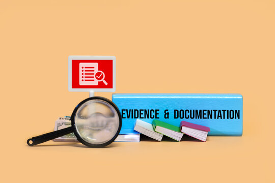 Evidence and documentation concept with magnifying glass