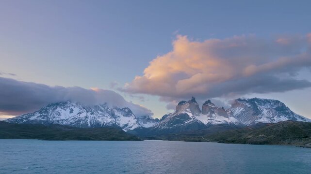 4K video; timelapse of clouds moving over the Paine mountain range at sunset, Torres del Paine National Park, Chile