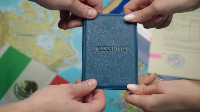 Migration officer issues Mexican passport to new citizen against world map and documents with approval stamps.