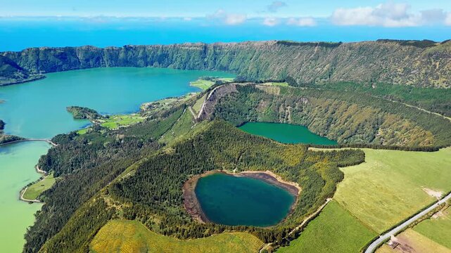 Dual crater lakes inside large volcanic caldera at Sete Cidades on Sao Miguel Island, drone footage