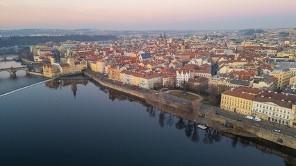 Fototapeta premium Sunset aerial view of Smetanovo nabrezi riverside in Prague, Cze