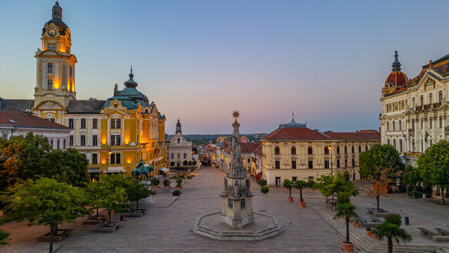 Sunrise at Szechenyi square in the old town of Pecs, Hungary