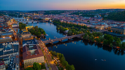Fototapeta premium Sunset aerial view of National theatre at Smetanovo nabrezi rive