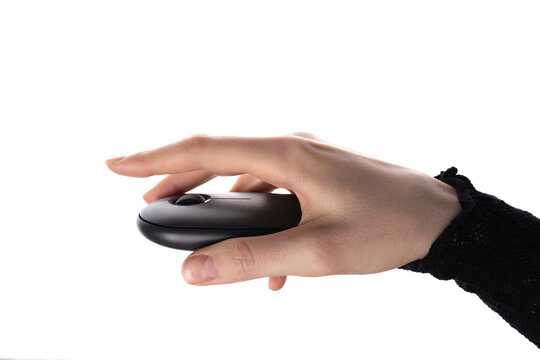Female hand holding wireless computer mouse with scroll wheel, isolated on white background, studio closeup of input device.